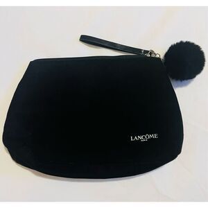 Black Lancome makeup bag with pom pom handle